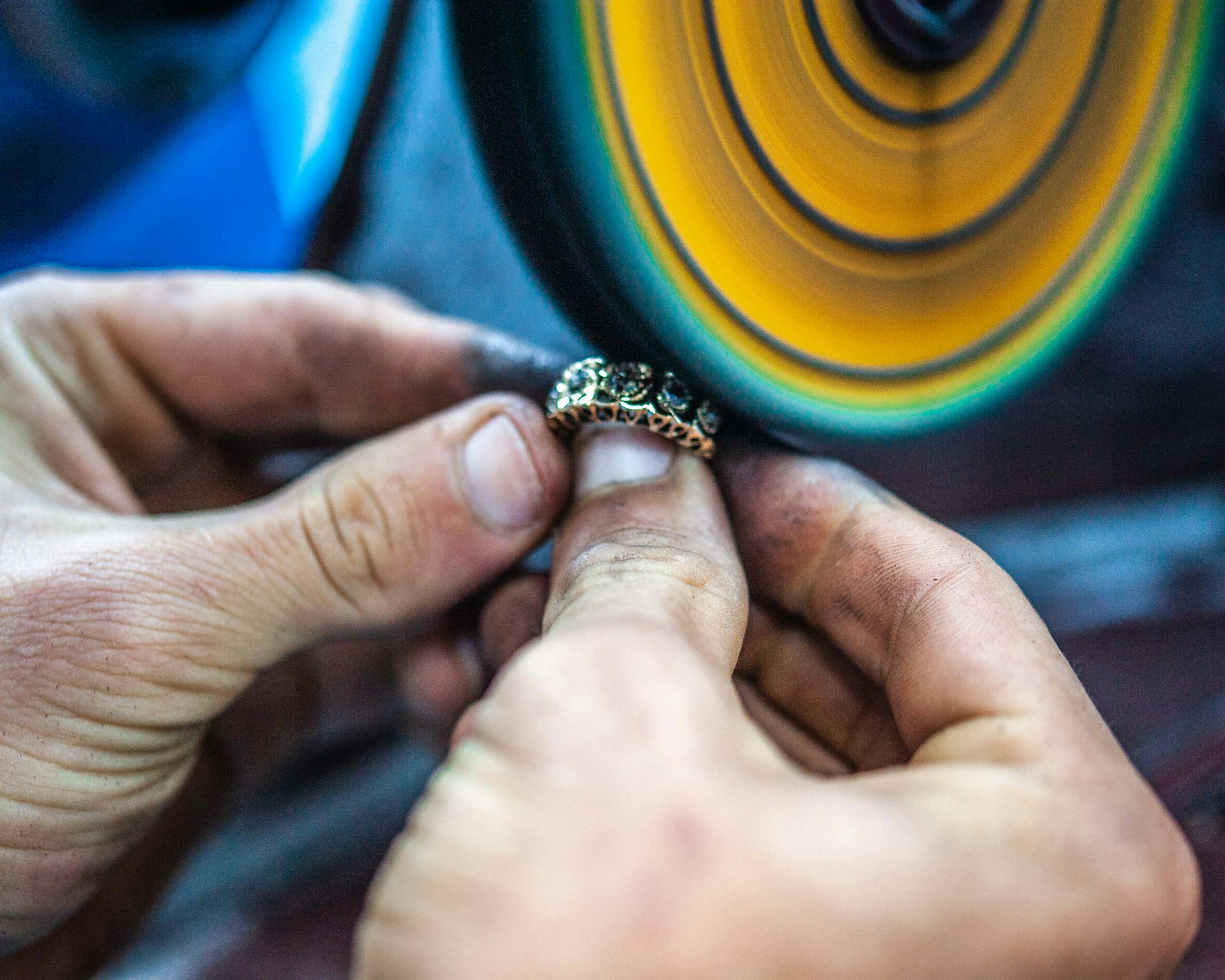 person holding black and yellow round ornament